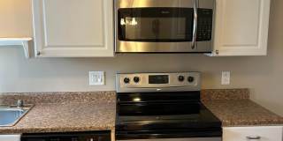 Modern Charm: 2 BR Home with Finished Basement, Pet Friendly, Assigned Parking, and Prime Location! Gallery 1