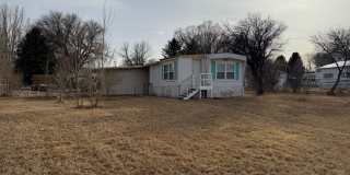 2 Bedroom 1.5 Semi-Rural Mobile Home with Workshop on Large Lot Gallery 1