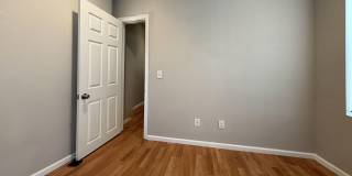 Charming 4BR/2BA Rowhouse with Hardwood-Style Flooring Throughout Gallery 13