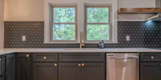 Completely remodeled like new Gingerbread midtown cottage with gleaming hardwoods, converted from a 3/1 to a 3/2. Gallery 19