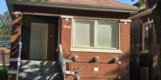 5-Bedroom Brick Bungalow with Finished Basement, Bonus Room, and Fenced Backyard Gallery 1