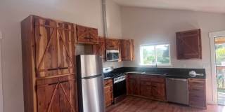 2 Bedroom 1 bath house with extra large double car garage and extra storage space! Gallery 8