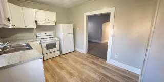1506 W 10th St - Charming 4-Bedroom Home with Abundant Light & Open Living Spaces Gallery 1