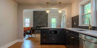 Completely remodeled like new Gingerbread midtown cottage with gleaming hardwoods, converted from a 3/1 to a 3/2. Gallery 16