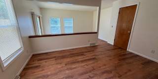 August 15th rent special! New deck! 3 Bedroom, updated kitchen, updated flooring, garage, driveway, and fenced yard - 9 month lease available! Gallery 32
