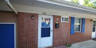 Hardwood floors, in-unit laundry, and restaurants a short walk away — under $1,250. Gallery 1