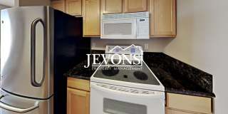 Coming soon! Charming top-floor condo with fully equipped kitchen - Water, sewer, and garbage included! Coming soon! Charming top-floor condo with fully equipped kitchen - Water, sewer, and garbage included! Gallery 1