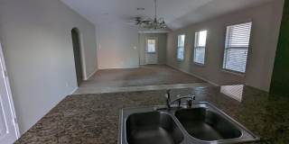 2 car garage with lighting, granite countertops. Backyard includes a custom extended concrete patio perfect for gatherings Gallery 15