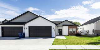 DARLING twin home located in Sugar City, Idaho 3 Bed 2 full baths with fully fenced yard and XL 2 stall garage Gallery 1