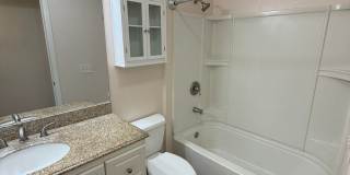 2BR/1BA Lakeside ground floor condo with 1 car detached garage, 1 uncovered parking space & community pool. Gallery 10