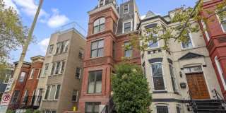 Stunning 3-bedroom, 2.5-bath two-level penthouse with den in historic Shaw, featuring soaring ceilings, a gourmet kitchen, luxurious primary suite, private rooftop deck with city views, gated parking, and easy Metro access. Gallery 1