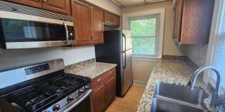 Fully fenced yard with stainless steel appliances including gas stove! Gallery 1