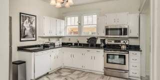 Welcome home to this stunning FULLY FURNISHED and AMPLE FREE PARKING for at least six cars! Gallery 9