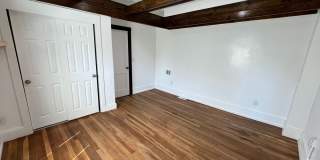 Stylish 2-Bedroom Unit Featuring Decorative Fireplace Gallery 10