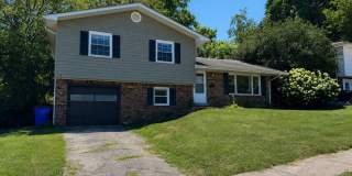 AVAILABLE NOW! Spacious 4 BR, 2 Bath House! Wood Floors, Attached Garage, W/D Included Gallery 1