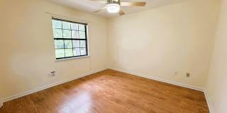 COZY 2/2 SE Townhome with Plank Floors, W/D, Stainless Steel Appliances, Carport, & W/D! Avail NOW for $1495 Gallery 21
