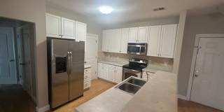 Don't miss this 4-bed, 3-bath condo TWO miles from the ocean! Gallery 4