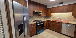 Rarely available 1-bedroom, 1-bathroom luxury apartment in the Punahou Cliffs Condominium. Gallery 1