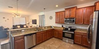 Stunning 8-Bedroom Champions Gate Pool Home  | Cable, Internet & Pool Care Included Gallery 4