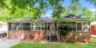 Updated Bungalow with Massive Deck and Fully Fenced Yard! Gallery 1