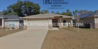 Spacious 4-Bedroom Home with Screened Porch in Pace Gallery 1