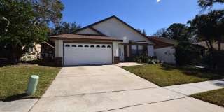 This charming 3 Bedroom, 2 Bath Single Family Home For Rent at 7313 Spring Villas Circle Orlando, FL 32819 Gallery 1