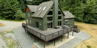 Stunning and spacious 3,620 SqFt Blue Lake home offers Forest tranquility, elegant furnishings Gallery 1