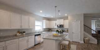 Get ready to fall in love—this sleek, modern beauty in West Creek Farms is bringing the wow factor to Clarksville! Gallery 10