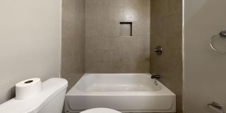 Charming 4BR/2BA Rowhouse with Hardwood-Style Flooring Throughout Gallery 14