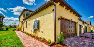 Annual Unfurnished Rental – Coach Home 3 Bedrooms, 2 Baths, 2 Car Garage, with Resort Like Amenities – Gran Paradiso Community! Gallery 1