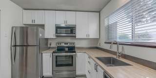 NW Vancouver Condo with Detached Garage & Dedicated Parking Gallery 1