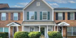 Discover this beautifully updated Raintree townhome featuring an open floor plan and a range of contemporary enhancements. Gallery 1