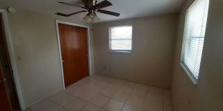 JUST REDUCED!!! 2/1.5/1 1000 Sq. Ft. NEW AC!!!Spacious living room, Lanai, fenced in yard, and tile floors thoughout! Gallery 7