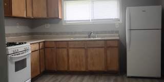 For Rent: 1213 W 17th St. 2 bedroom 1 bathroom Home! Nice porch! Nice back yard! New flooring! Washer & dryer hookups! Gallery 1