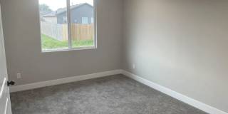 Single family slab home with three car garage. This home is 4 bedrooms, three bathrooms open floor plan. Zero entry home. Mowing included. Gallery 9