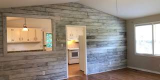 Travelers Rest !! 3 BR, 2 BA with Great Living Space - Den, Bonus Room, Primary Suite has a HUGE walk in Closet, Laundry Room, private screened in porch & deck AND a storage shed out back.  Fresh Paint and New LVP Floors Gallery 6