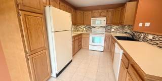 Spacious Townhome with Finished Basement, Fenced Yard & 2-Car Garage Spacious Townhome with Finished Basement, Fenced Yard & 2-Car Garage Gallery 3
