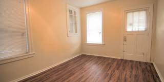 This 2 bedroom 1 bath home has been completely refinished with brilliant hardwood floors throughout! Gallery 7