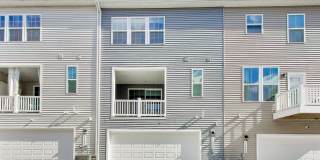 Welcome to this beautifully designed 3 level townhome in Westphalia Town Center Community! Gallery 32
