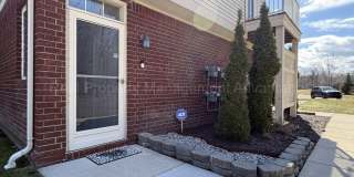 Rare Corner Upper Condo with Vaulted Ceilings, Private Balcony and 2 Car Garage - Right Across from the GM Tech Center! Gallery 1