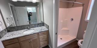 4 Bedroom / 4 bath New Townhome. Every bedroom is its own Master Suite with your own full bathroom, walk in closet and A/C unit. Full-size washer and dryer in your unit. Gallery 29