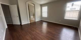 Single-level 3-bedroom home in a desirable Chandler location featuring a 2-car garage and tile roof and wood plank flooring throughout Gallery 20