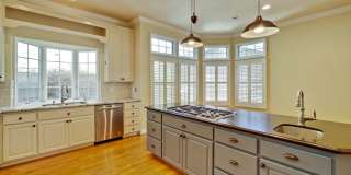 Stunning two-story spacious home on tranquil tree-lined street. Gallery 26