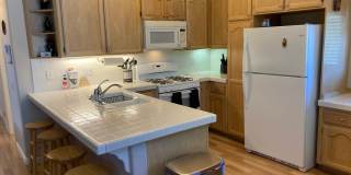 Location! Location! Terrific Four bedroom Three Bath Home with Two Car Garage including Lake Rights! Gallery 8