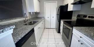 3/2 Regency Gardens 1st Floor Condo with New Plank Fooring, Stainless Appliances, and Fresh Paint! Gallery 11