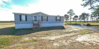 County Quiet Setting- Doublewide- Split Floor Plan with Deck- Grass, Water, Sewer included Gallery 1