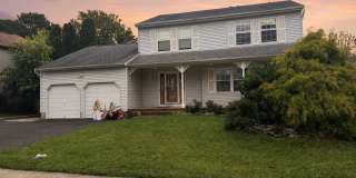 Bright 3-Bedroom Howell Home with Fireplace, Deck & Garage Gallery 1
