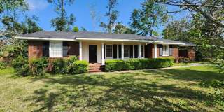 Charming 3BR/2BA Brick Home with Vintage Flair, Expansive Backyard  Walk to VSU! Gallery 1