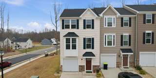 Welcome to this like new fully furnished home located in The Village at Courthouse Commons in Spotsylvania. Gallery 1