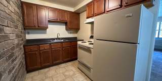 One Bedroom Apartment with Exposed Brick & Off-Street Parking! Tour this Stunning One Bedroom Today! Gallery 1
